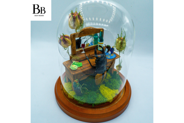 insect diorama with miniature book the beetles dilemma